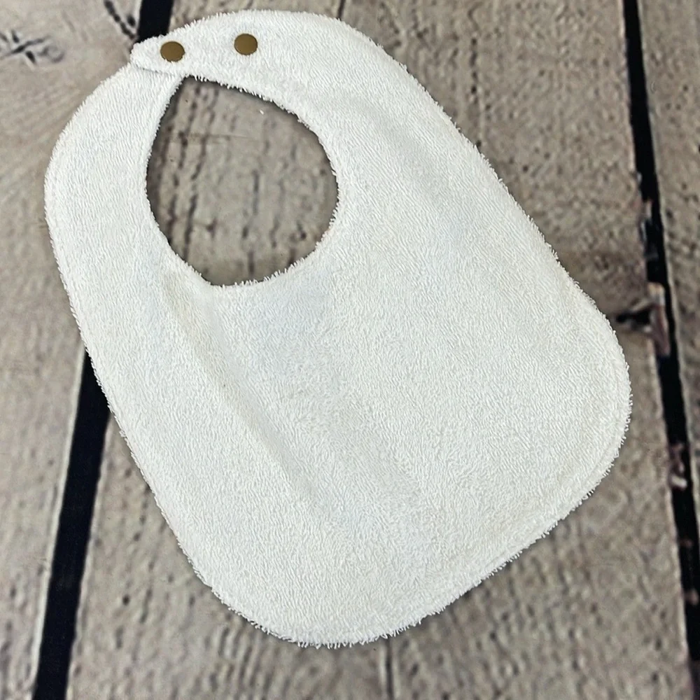 Designer handcrafted dinosaur bib
